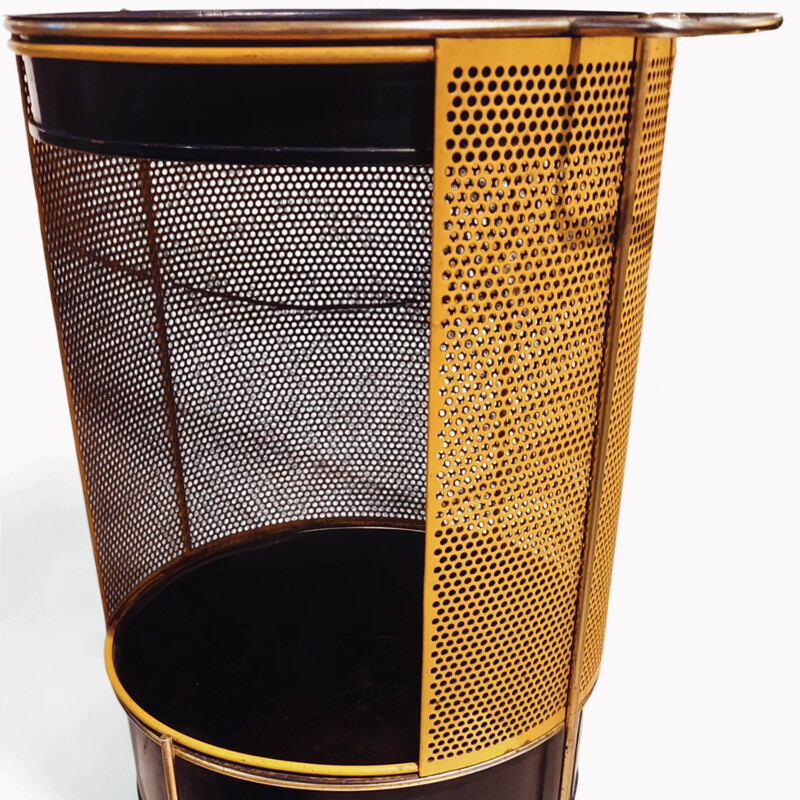 F 355 JC DescriptionBlack and yellow perforated dry bar or side table in the style of Mathieu Matégot