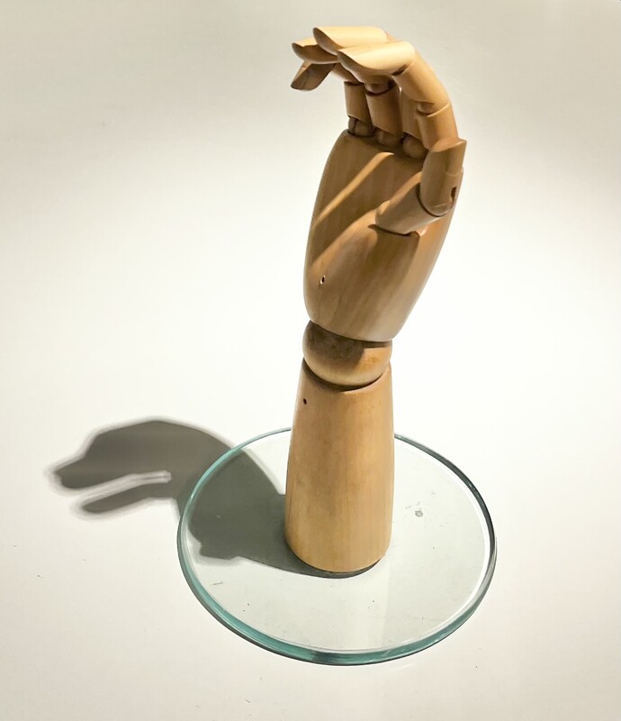 M 281 JC articulated wood hand with glass base 